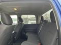 Interior view of the backseat of a 2019 RAM 1500 Classic with two black upholstered seats and a spacious cabin design
