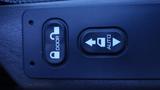 Close-up of a control panel featuring two buttons labeled door and auto for a 2017 International 4300 vehicle