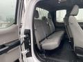 Interior view of a 2017 Ford F-250 SD showing the backseat area with gray upholstery and seatbelts