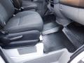 Interior of a 2016 Mercedes-Benz Sprinter showing two front seats with fabric upholstery and rubber floor mats