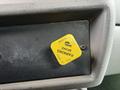A yellow parking brake release knob labeled with "PARKING" and "PULL TO RELEASE" on a dashboard surface of a 2014 Kenworth T370