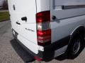 A 2016 Mercedes-Benz Sprinter van with a white body and prominent rear lights featuring the BlueTEC badge