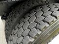 Close-up of a 2006 Freightliner M2 112 tire showing tread patterns and wear on the rubber surface