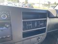 Dashboard of a 2012 GMC Savana featuring controls and air vents