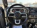 2021 Jeep Gladiator steering wheel with control buttons and instrument cluster visible behind it