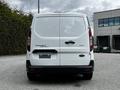 A 2019 Ford Transit Connect with a white exterior showcasing its rear doors and the model name in silver lettering on the back