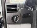 Dashboard controls of a 2012 Mercedes-Benz Sprinter including air vent light switch and dashboard dimmer controls