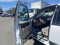 A 2013 Ford Expedition with the driver's side door open showing the interior features like seats and dashboard