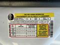 A 2014 Ford F-250 SD tire and loading information label detailing seating capacity and tire pressure specifications