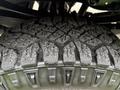 Close-up of the rugged tire tread of a 2015 Ford F-350 SD showcasing deep grooves and textured surface for enhanced traction and durability