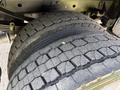 A close-up view of a tire from a 2019 Ford F-550 showcasing its tread pattern and wear details