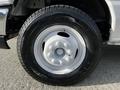 Close-up of a white wheel with a tire marked 225/75R16 on a 2013 Ford Econoline