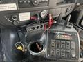 The interior dashboard of a 2012 Chevrolet Express showing various controls gauges and ports