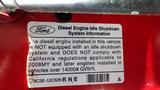 Label on a 2010 Ford F-550 stating the diesel engine does not have an idle shutdown system and does not meet California regulations for certain engine installations