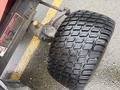 Close-up of a rear tire on a 2010 Kubota F3680 featuring a textured tread design and a metallic axle attachment