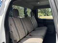 Interior backseat of a 2017 Ford F-550 with patterned fabric upholstery and seatbelts visible