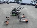 Three Honda Lawnboy mowers and two Stihl line trimmers arranged in a row on a flat surface