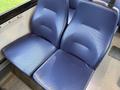 A pair of blue textured seats from a 2020 Chevrolet Express with a padded design and smooth surfaces