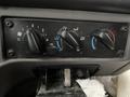Control panel with knobs for temperature and airflow settings in a 2020 Freightliner 114SD