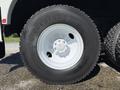Close-up view of a Bridgestone tire mounted on a white rim belonging to a 2008 International 7500 truck