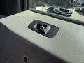 Interior detail of a 2017 Ford F-350 SD showing the window control switch on the driver's side door panel