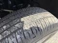 Close-up of a tire from a 2016 Chevrolet Silverado 2500HD showing tread pattern and wear on the surface
