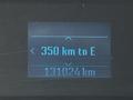 A digital display showing a 2017 Ford F-250 SD with a range of 350 km to empty and an odometer reading of 131024 km
