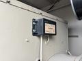 A 2005 Katolight SED60FPJ4 control module mounted on a wall with a label and electrical connections visible