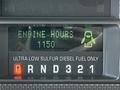 Dashboard display of a 2009 Ford F-550 showing engine hours as 1150 with indicators for low sulfur diesel fuel and gear selection P R N D 3 2 1