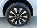 A close-up view of a black and silver alloy wheel from a 2022 Mercedes-Benz Metris displaying a prominent Mercedes-Benz logo in the center