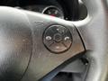 Close-up of a steering wheel control panel from a 2017 Mercedes-Benz Sprinter featuring buttons for phone call functions and volume adjustments
