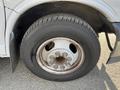 Close-up of the wheel and tire of a 2018 Chevrolet Express showcasing the rim and tread of the tire