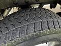 Close-up of a textured tire from a 2017 Mercedes-Benz Sprinter showing detailed tread pattern and sidewall design