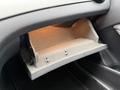 The image shows the open glove compartment of a 2016 Mercedes-Benz GLA-250 with a light illuminating its interior