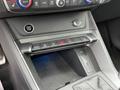 Center console of a 2024 Audi Q3 showing controls for drive settings climate system and keyless start