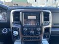 Interior dashboard of a 2017 RAM 1500 featuring a touchscreen display with various controls and navigation options
