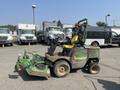 A 2012 John Deere 1445 Lawn Mower with a green and yellow color scheme featuring a comfortable seat and two large mowing decks