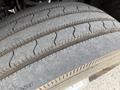 Close-up of a tire from a 2013 Ford F-550 showing tread patterns and wear on the rubber surface