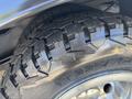 Close-up view of the tread on a tire from a 2017 Chevrolet Express showcasing its rugged design and deep grooves for traction