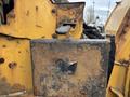 A close-up of a rusty metallic control panel on a 2015 Vermeer Corporation BC1200XL with a handle and a worn metallic surface