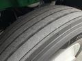 A close-up of a 2015 Freightliner M2 106 tire showing the tread and rubber detail