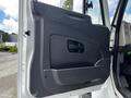 The image shows the interior door panel of a 2017 International WorkStar 7600 featuring a black plastic finish and a handle for opening the door