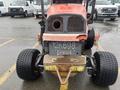 A red 2010 Kubota F3680 with large rear tires and a visible license plate number 12K698 is parked in a lot facing forward