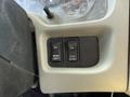 Two switches are mounted on a panel labeled WORK LIGHT and FAN with an ON position indicated for both switches