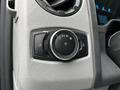 Close-up of the control knob for headlights and dashboard lights in a 2021 Ford E-450 interior
