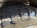 Close-up of a tire with deep treads designed for enhanced traction typically found on vehicles like the 2017 Chevrolet Express