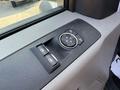 Close-up of the control panel of a 2022 Ford F600 featuring window controls and a circular dial for mirror adjustments