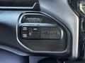 Close-up of a 4x4 drive selector switch in a 2022 RAM 3500 featuring options for 2WD 4WD high and 4WD low