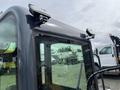 A 2024 AGT Industrial Yellow H13R Mini Excavator with a clear cab featuring lights mounted on top and visible controls inside the cabin