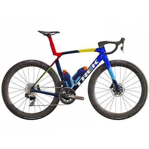 2025 Trek Madone SLR 7 Axs Gen 8 road bike with a sleek aerodynamic frame featuring vibrant colors and equipped with disc brakes and carbon wheels